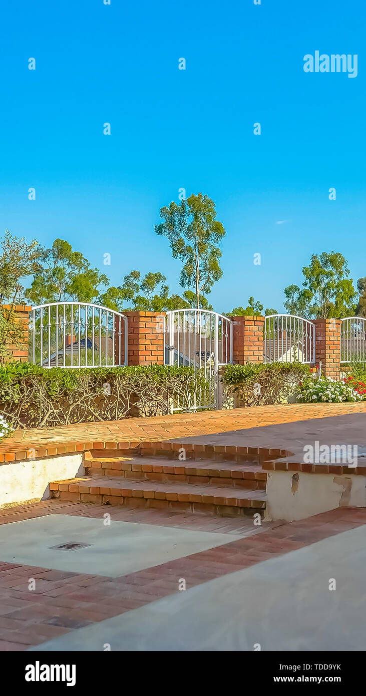 Vertical frame Brick patio with a raised platform in front of the ...