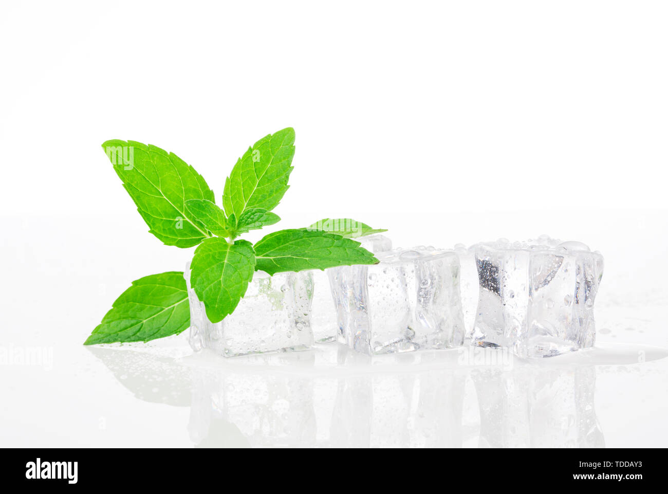 Fresh mint leaves and ice cubes, crisp summer Stock Photo