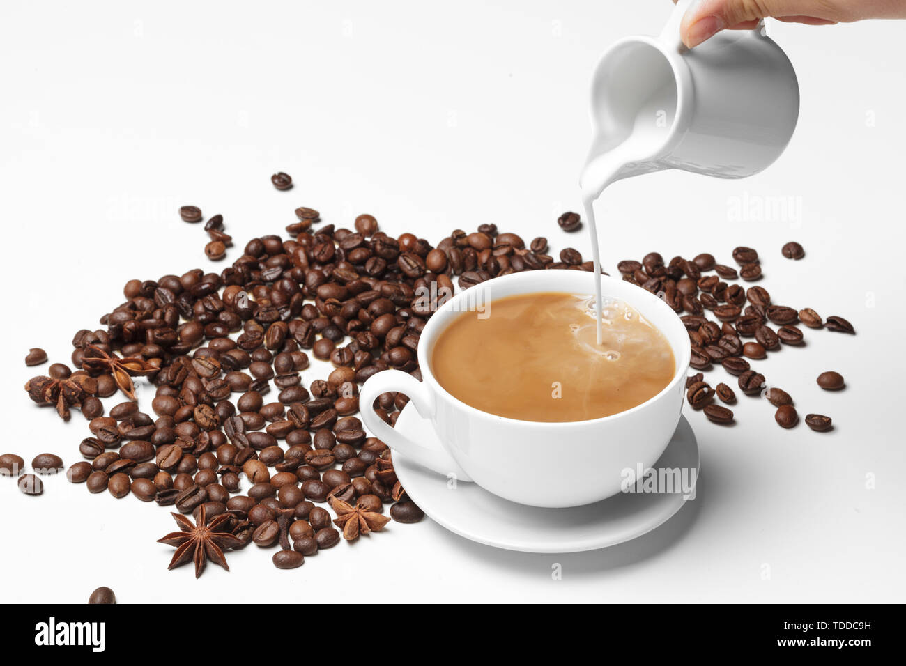 Coffee bean small cup full of coffee bean isolated on white Stock Photo