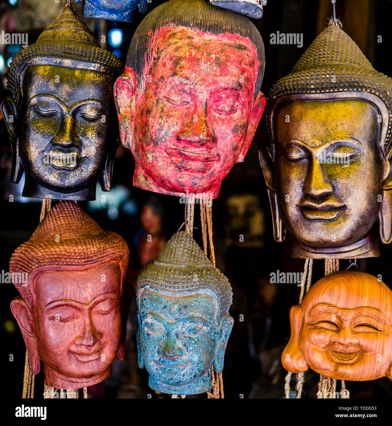Old craft market showing carved buddha head masks, Siem Reap, Cambodia Stock Photo