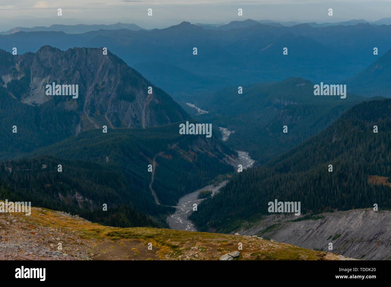 Photo inspiration: And The Surrounding Mountains Reference: Nisqually River And Surrounding Mountains In Mt Rainier Stock Photo