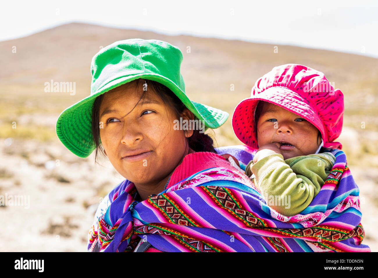 Portrait of a Quechua woman with a baby in the Reserva Nacional de Salinas y Aguada Blanca, Arequipa, Peru, Stock Photo