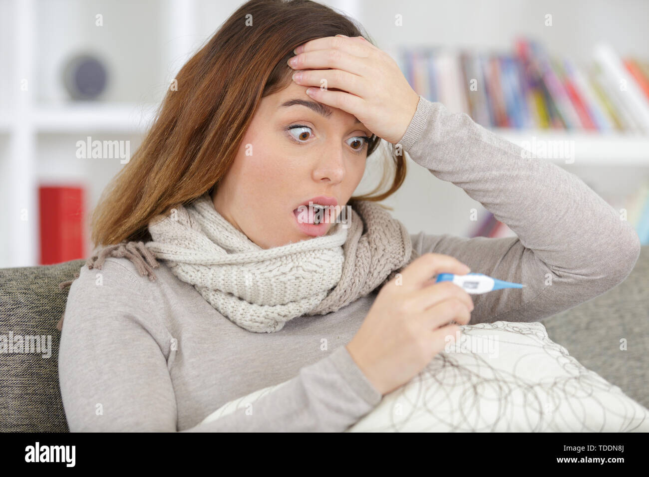 portrait of shocked female checking temperature Stock Photo - Alamy