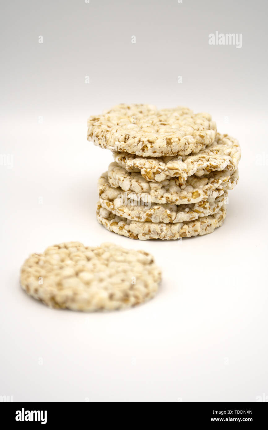 Grain crispbreads on white background. Puffed whole grain crispbread. Dieting Eating Concept. Copy space Stock Photo