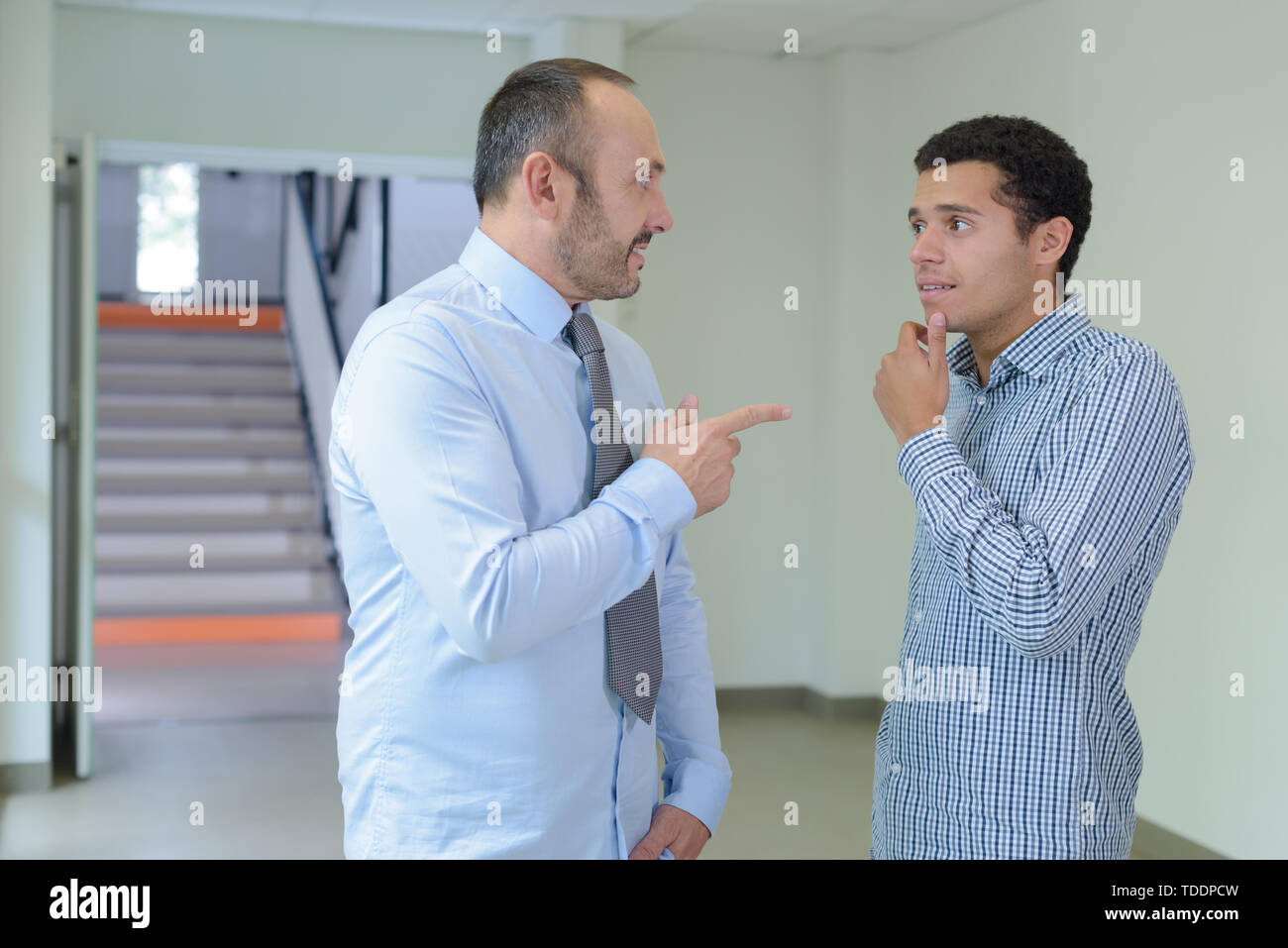 Teacher student talking hallway hi-res stock photography and images - Alamy