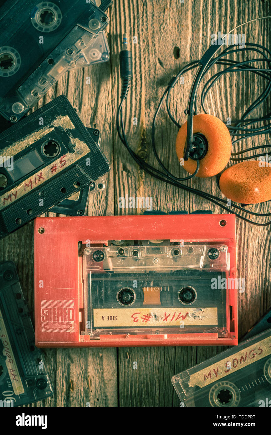Vintage cassette tapes with radio-cassette player on a wooden table Stock  Photo - Alamy