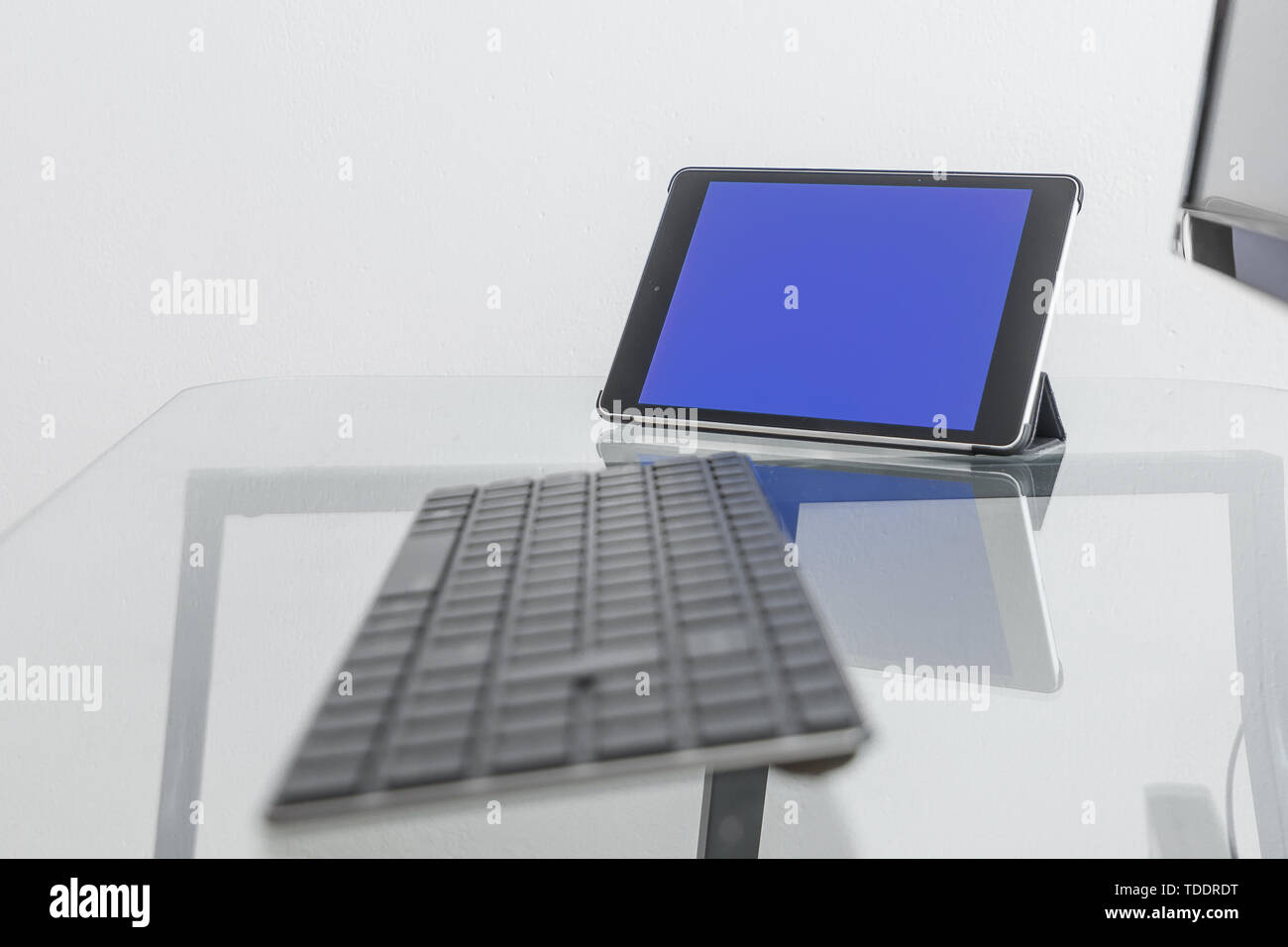 Screen of Tablet has Blue Chroma Key Great for Mockup Template. Freelance Office Work Space. Stock Photo
