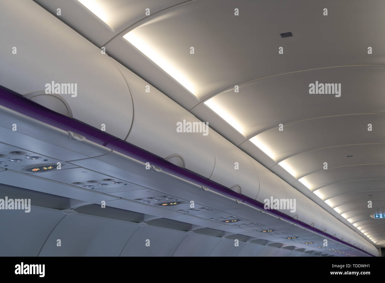 Carryon luggage in overhead storage compartment on commercial airplane