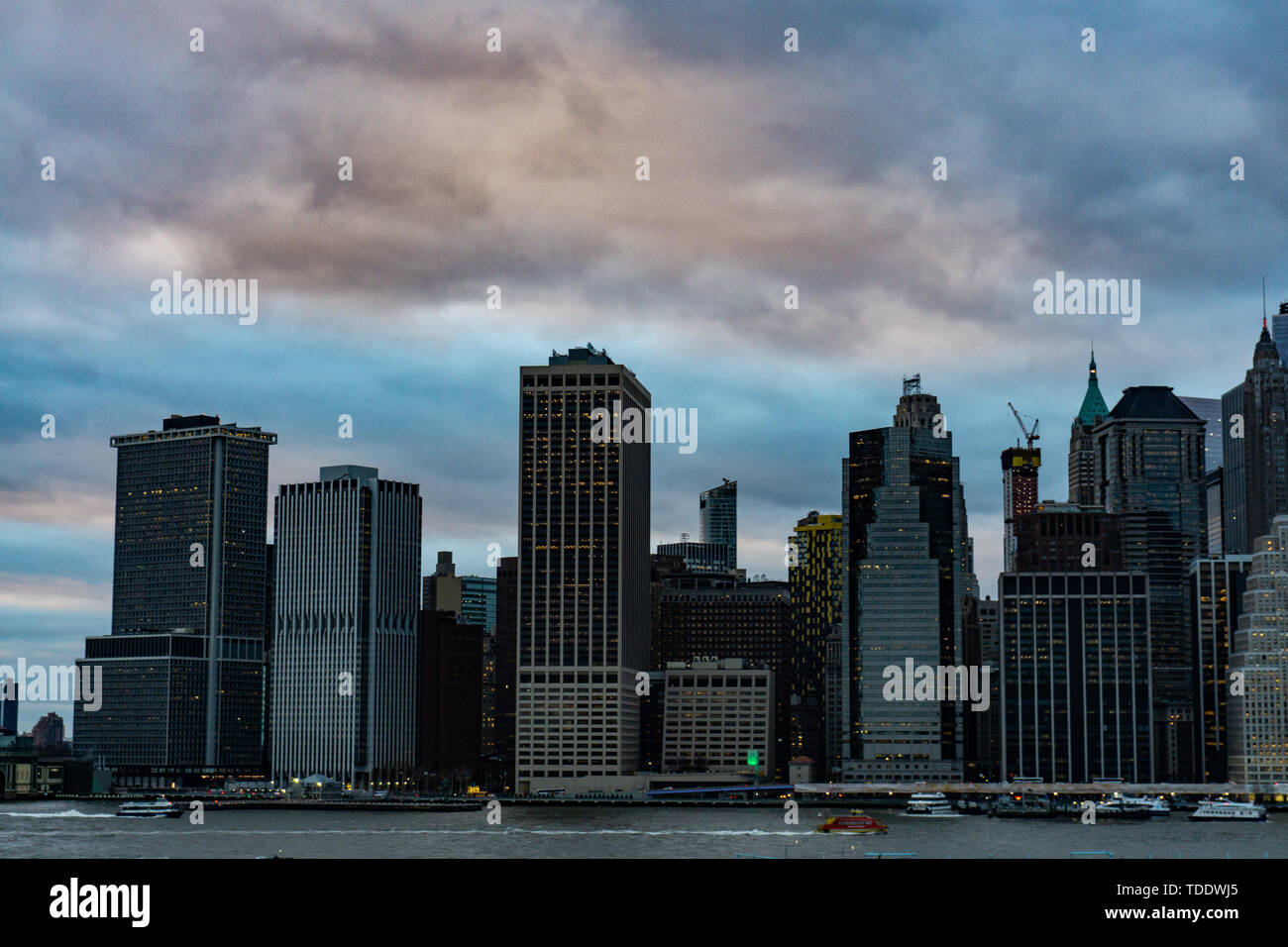 Skyscrapers waterfront sunrise manhattan hi-res stock photography and ...