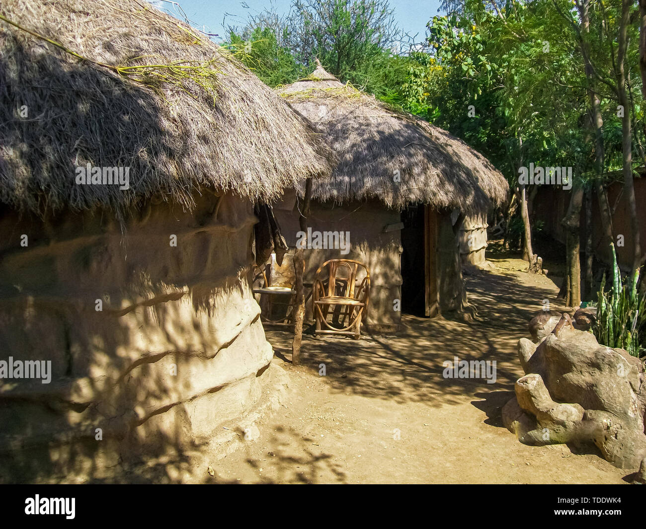 African Huts covered with trees, african tribal people house Stock Photo