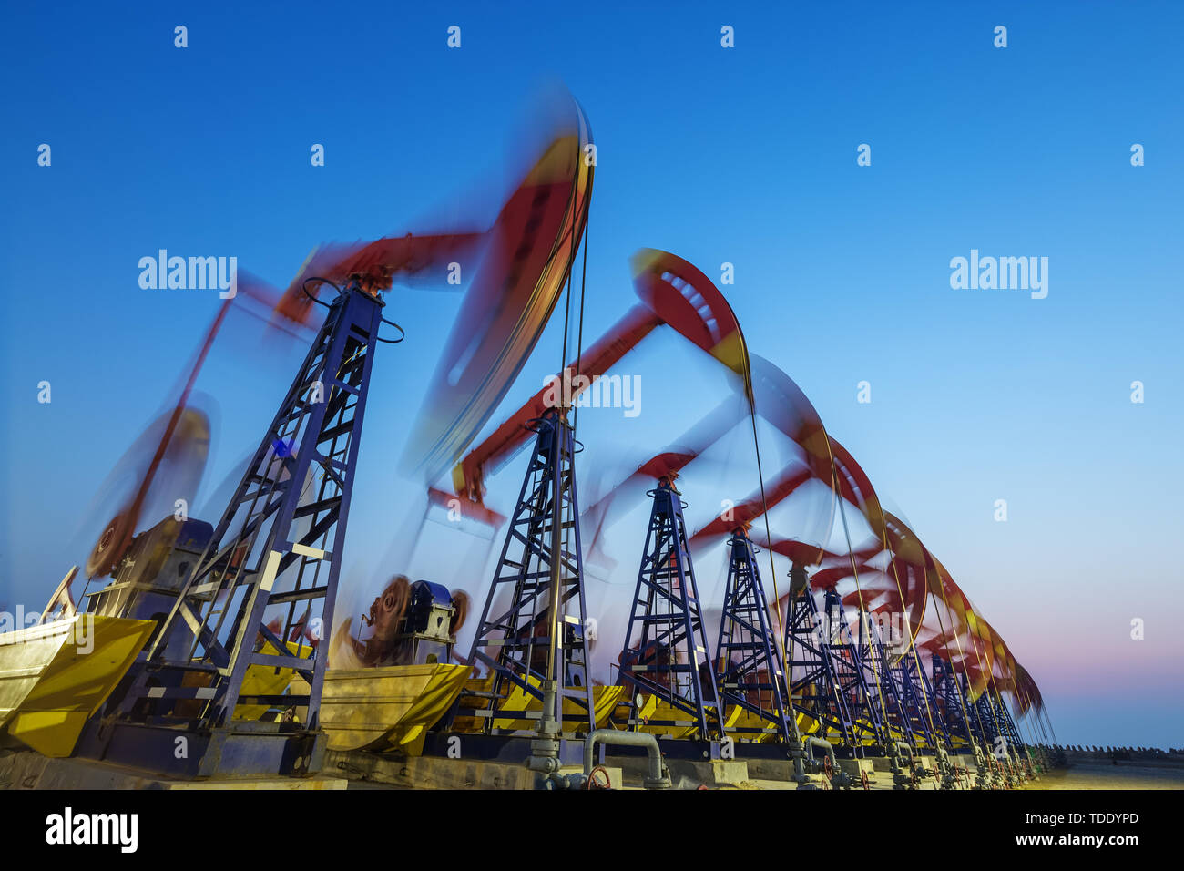 landscape of oilfield with pump units in blue sky Stock Photo - Alamy