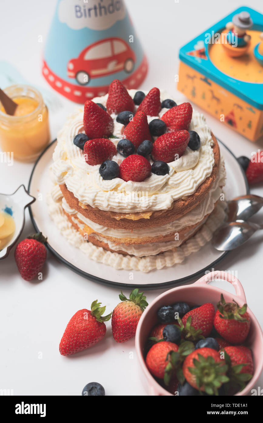 Strawberry birthday cake Stock Photo - Alamy