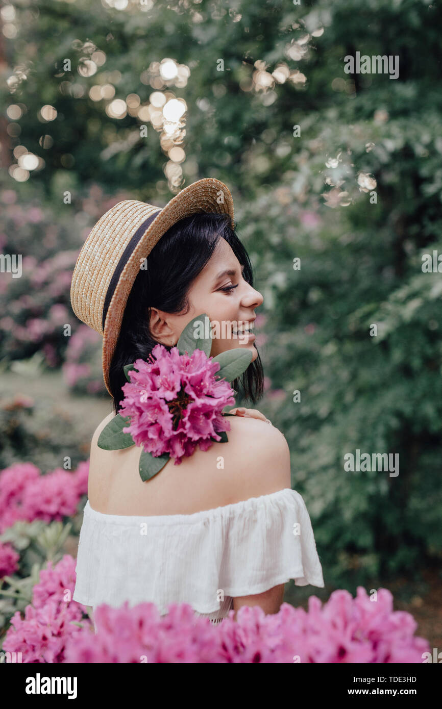 Close up portrait of a beautiful girl in a white vintage dress and ...