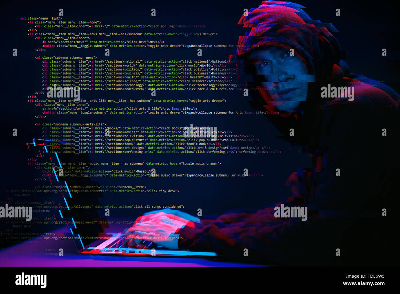 Hacker working with laptop in dark room with digital interface around. Image with glitch effect. Stock Photo