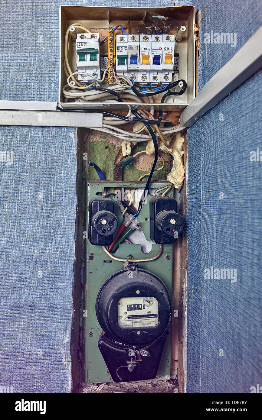 Old burned out electrical distribution panel and circuit breakers with