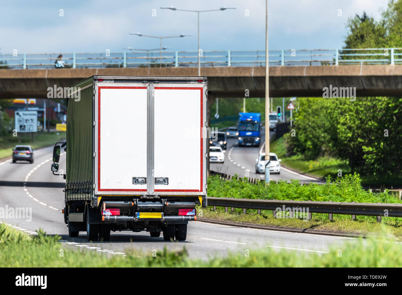 curtain side lorry truck on uk motorway in fast motion Stock Photo