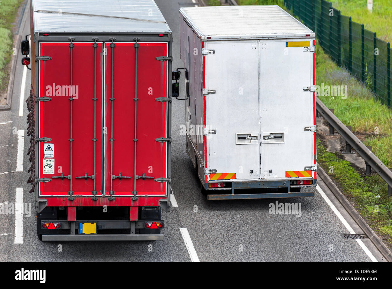 two box lorry trucks on uk motorway in fast motion Stock Photo Alamy