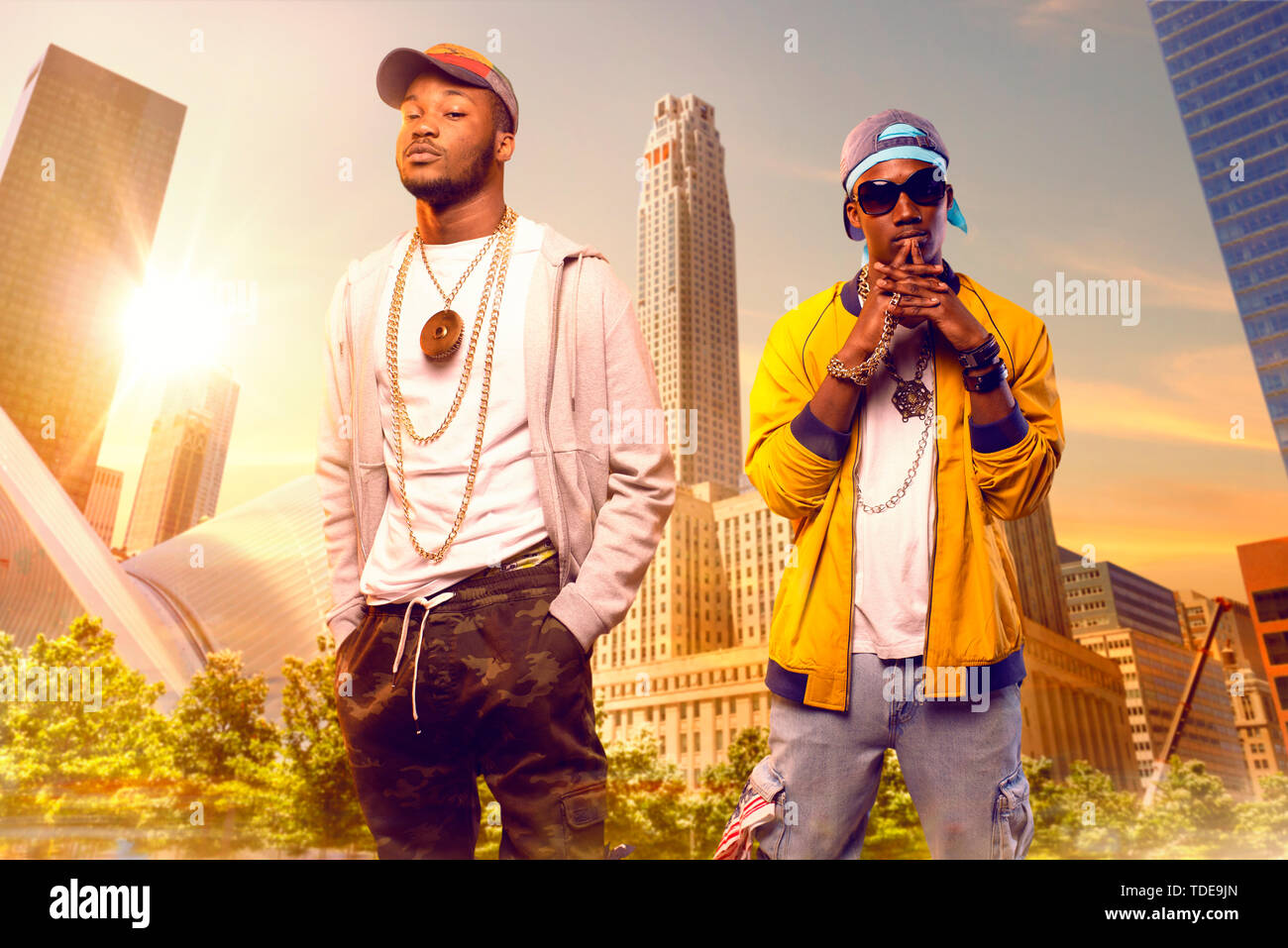 Two black rappers in caps, cityscape on background Stock Photo