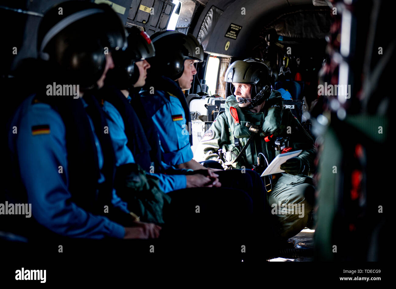 Bornholm, Denmark. 14th June, 2019. Marine soldiers are waiting in a Sea King helicopter for departure from the 'Bonn' task force supplier, which operates near the Danish island of Bornholm. The ship of the German Navy takes part in the Nato manoeuvre 'Baltops' on the Baltic Sea. Credit: Axel Heimken/dpa/Alamy Live News Stock Photo