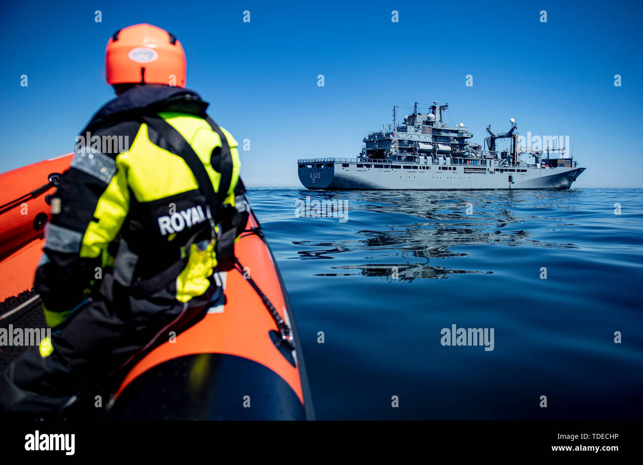Bornholm, Denmark. 14th June, 2019. A speedboat of the Royal Danish Navy is approaching the task force supplier 'Bonn', which operates near the Danish island Bornholm. The ship of the German Navy takes part in the Nato manoeuvre 'Baltops' on the Baltic Sea. Credit: Axel Heimken/dpa/Alamy Live News Stock Photo