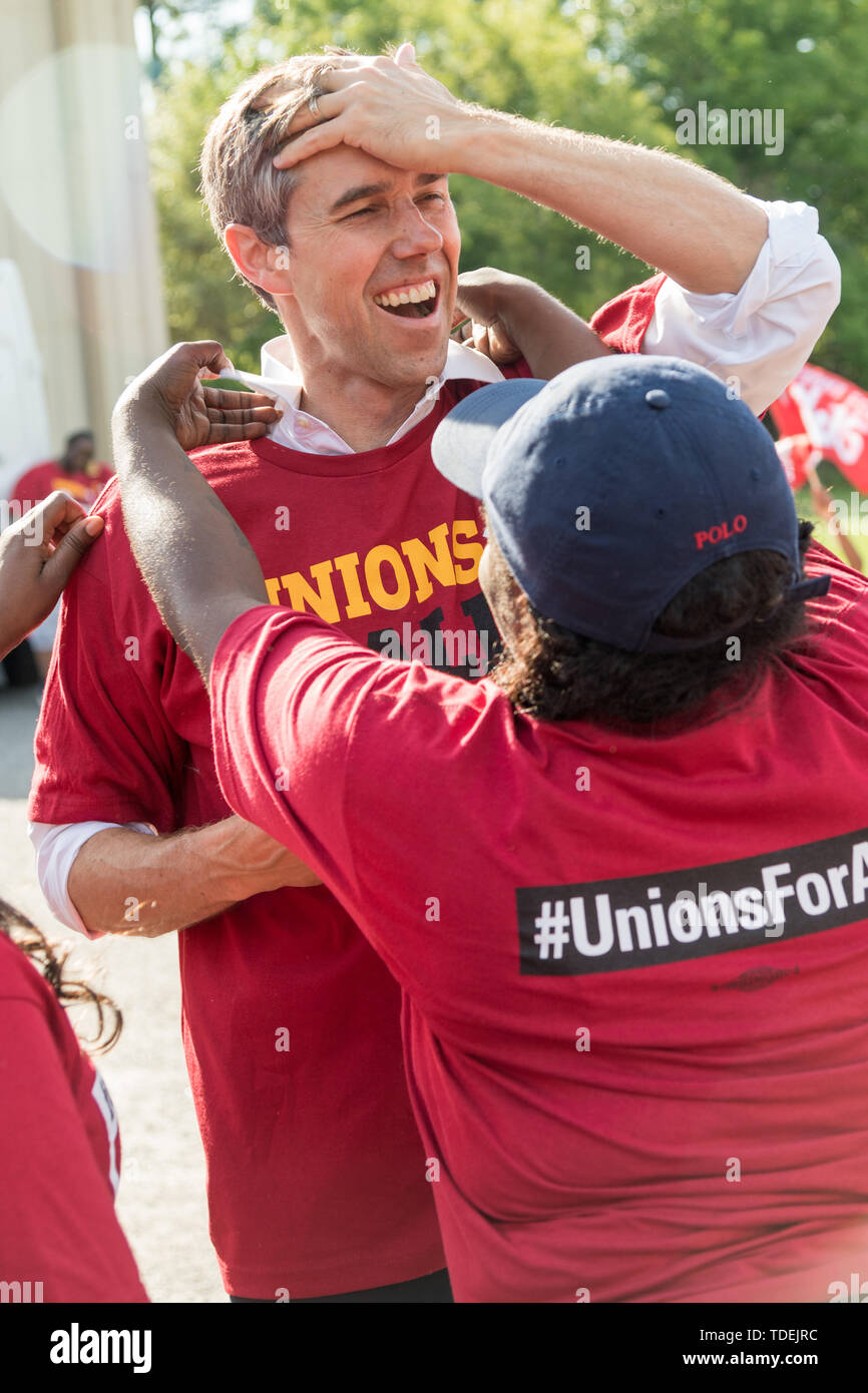 Charleston, United States. 15th June, 2019. Democratic presidential hopeful Beto O'Rourke adjusts his hair after putting on a union tee shirt as he joins McDonals workers in a one day strike as part of the Fight for $15 dollar minimum wage effort by a consortium of trade unions June 15, 2019 in Charleston, South Carolina. Credit: Planetpix/Alamy Live News Stock Photo