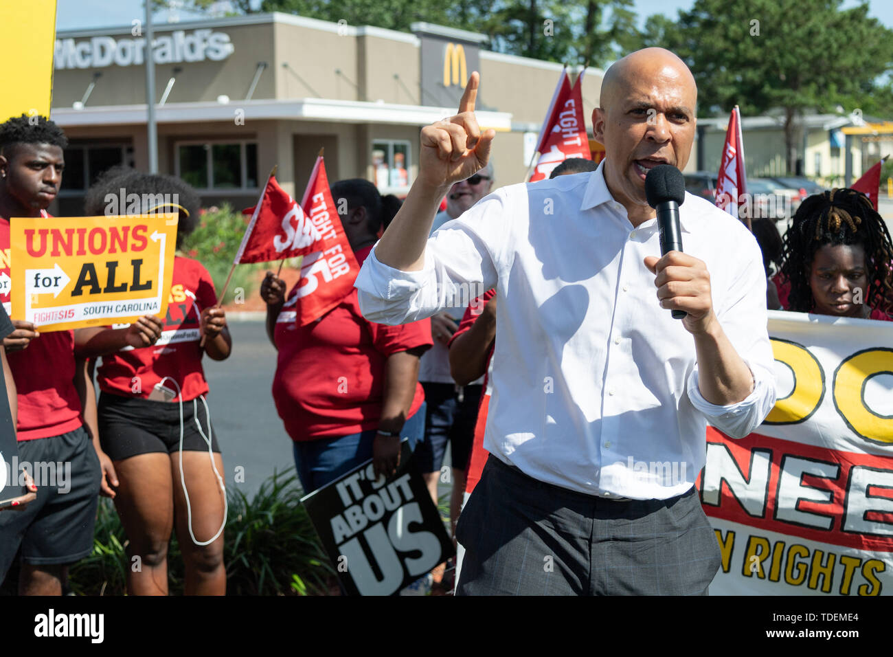 Charleston, United States. 15th June, 2019. Democratic presidential hopeful Sen. Cory Booker joins McDonals workers in a one day strike as part of the Fight for $15 dollar minimum wage effort by a consortium of trade unions outside a McDonald's restaurant June 15, 2019 in Charleston, South Carolina. Credit: Planetpix/Alamy Live News Stock Photo