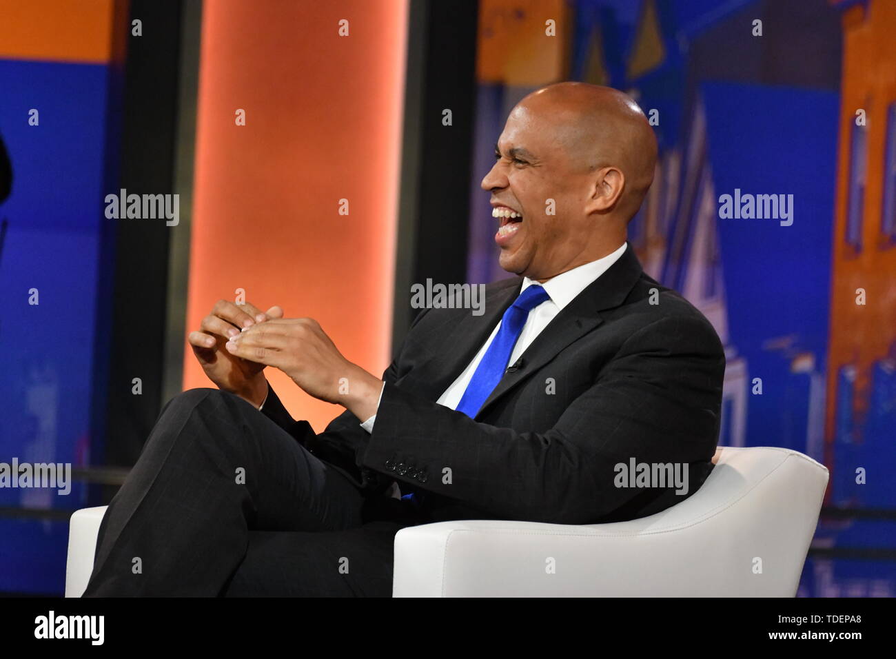 Charleston, USA. 15th June, 2019. Democratic presidential hopeful Senator Cory Booker jokes with moderator Soledad O'Brien during the Black Economic Alliance Presidential Forum June 15, 2019 in Charleston, South Carolina. Credit: Planetpix/Alamy Live News Stock Photo