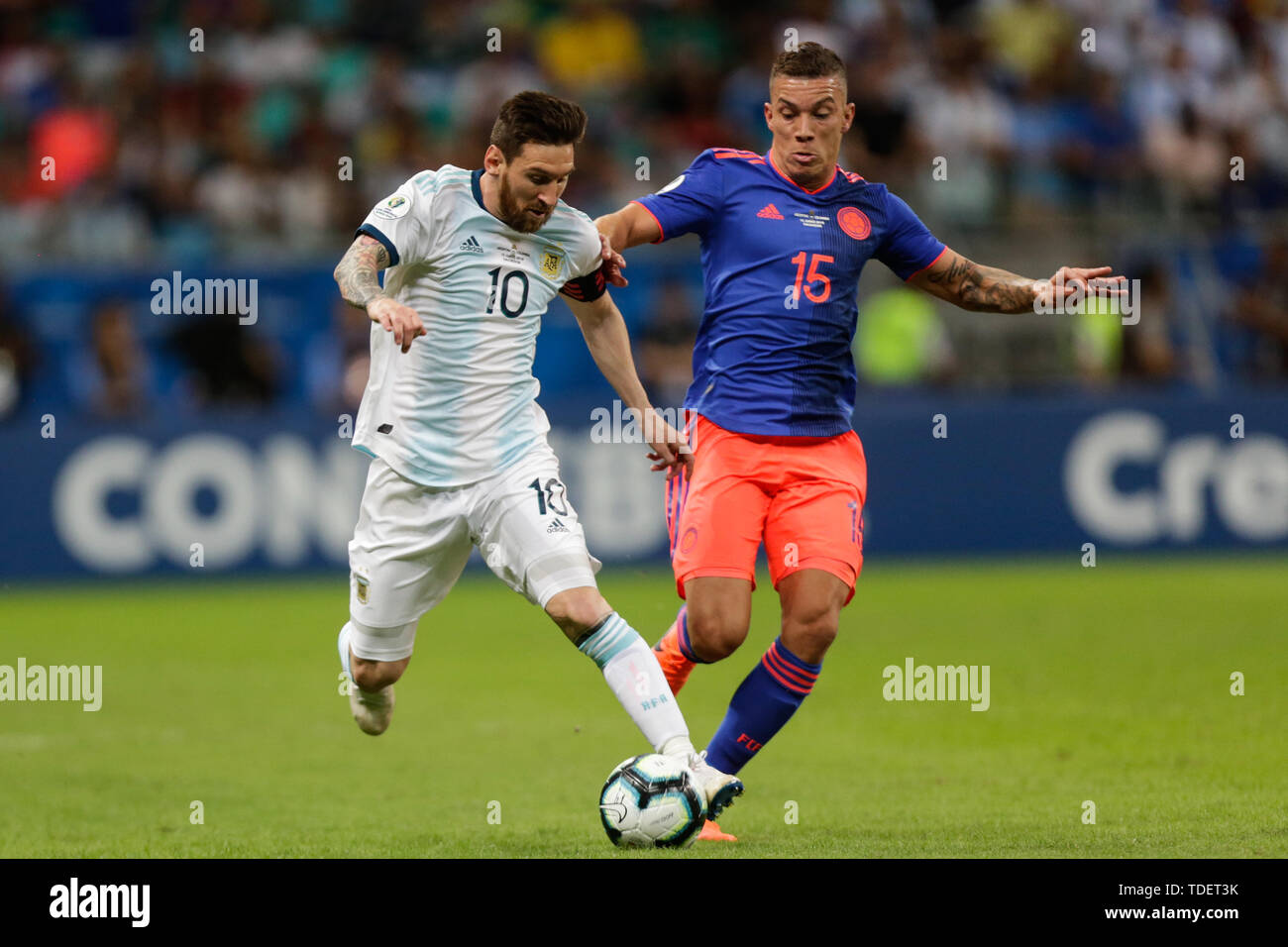 Salvador, Brazil. 15th June, 2019. Argentina's Lionel Messi(L) competes with Mateus Uribe of Colombia during the Copa America 2019 Group B match between Argentina and Colombia in Salvador, Brazil, June 15, 2019. Colombia won 2-0. Credit: Francisco Canedo/Xinhua/Alamy Live News Stock Photo