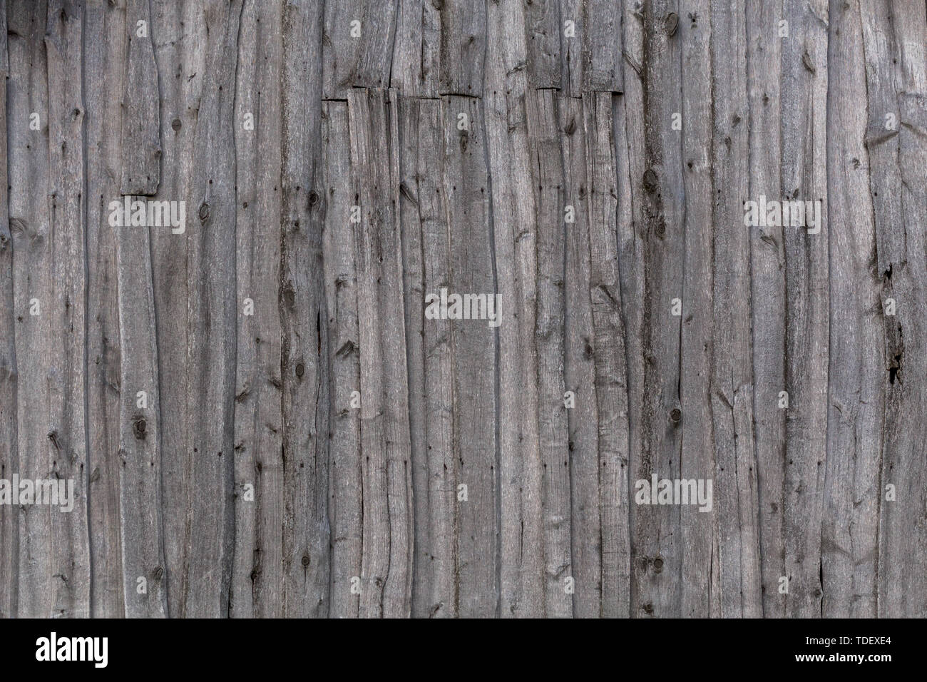 gray wooden weathered barn wall flat background template. Stock Photo