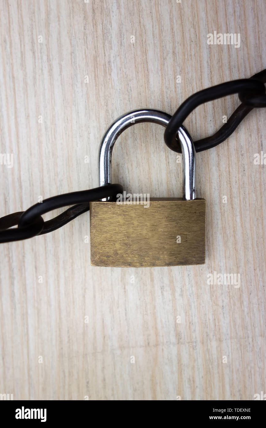 A copper lock with an iron chain Stock Photo Alamy