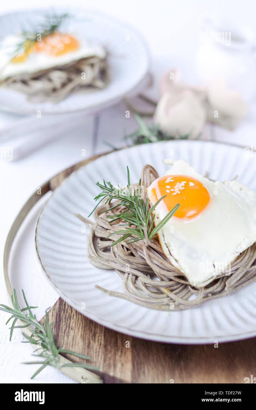 Fried eggs, buckwheat noodles Stock Photo Alamy