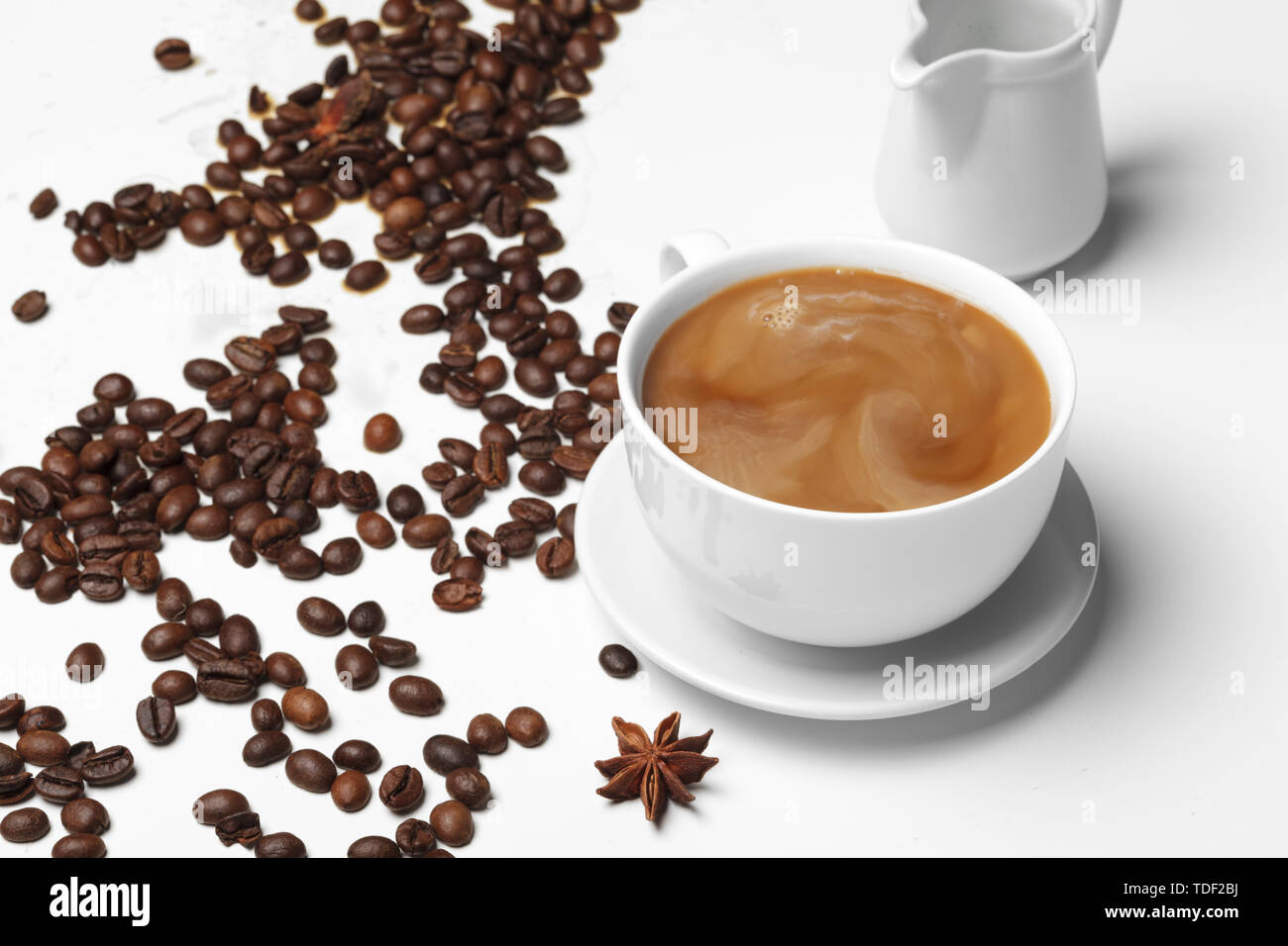 Coffee bean small cup full of coffee bean isolated on white Stock Photo