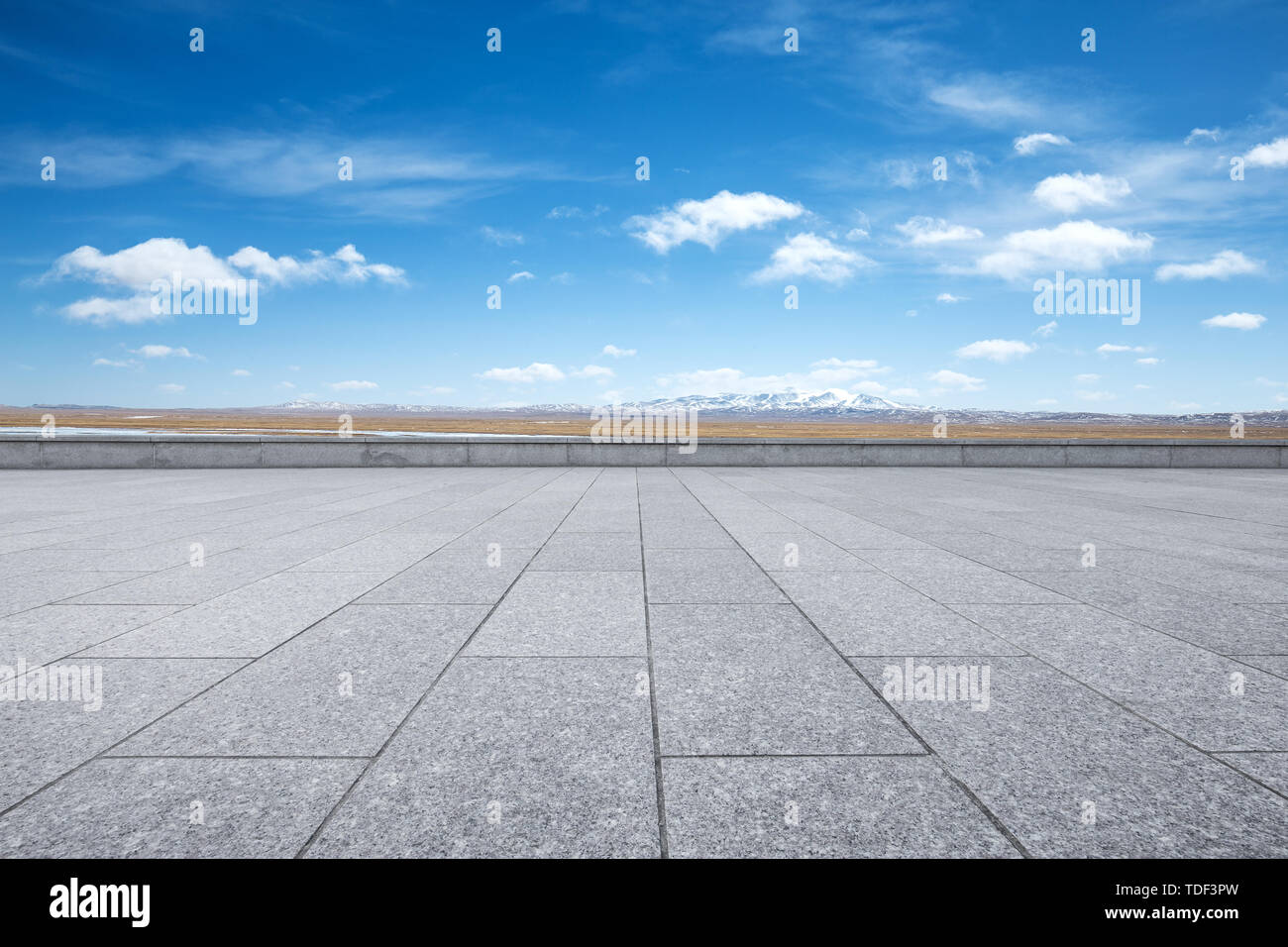 Empty marble floor with snow mountains Stock Photo