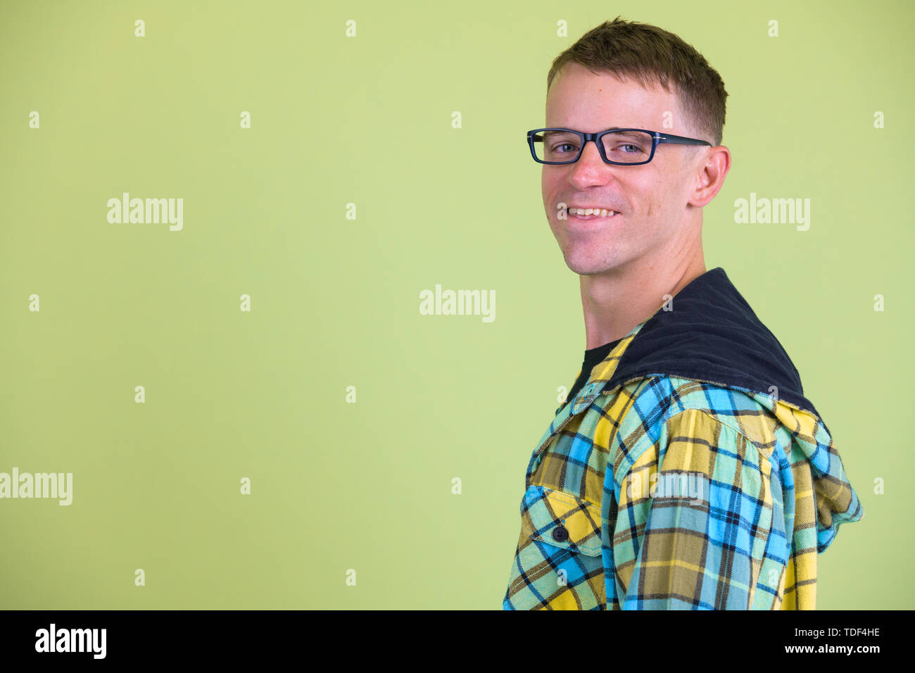 closeup profile view of happy nerd man with eyeglasses smiling and looking at camera stock photo alamy alamy