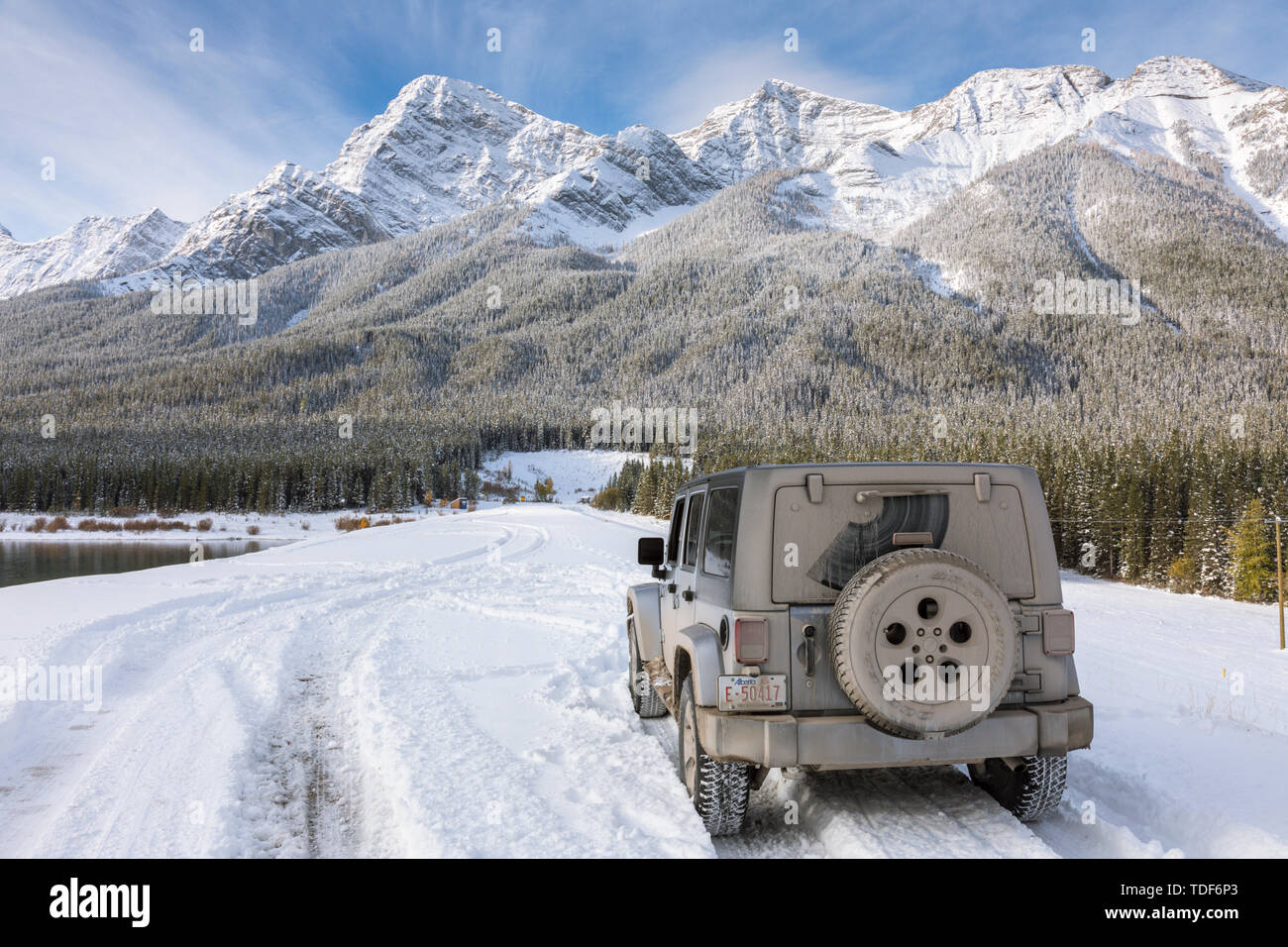 Car in front of an amazing Mountain Scene, Spray Valley Lakes Provincial Park, Canmore, Alberta, Canada Stock Photo