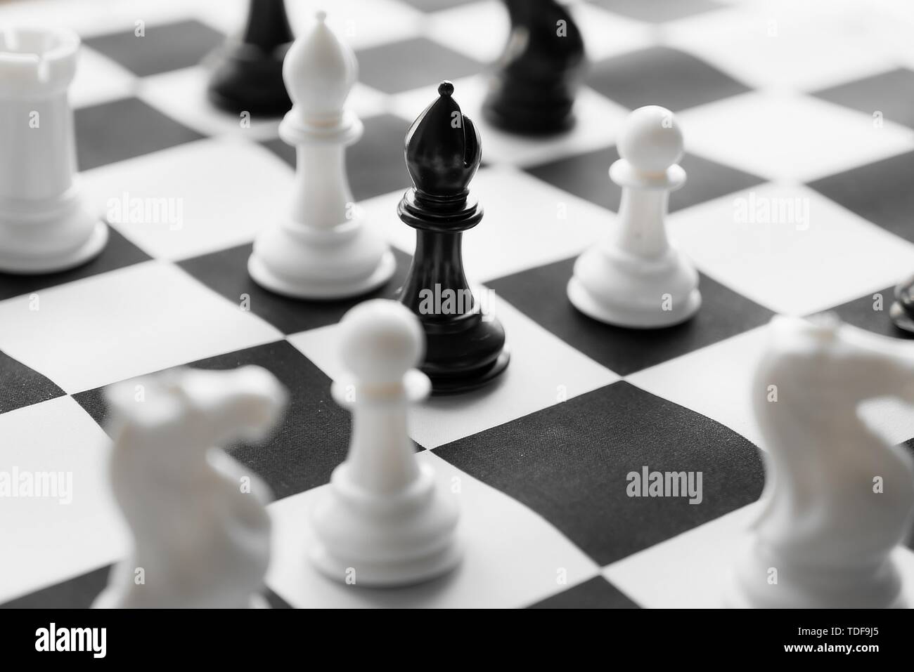 A black-and-white chess set that conveys the concepts of competition, matchups, victories, defeats, strategies, etc. Stock Photo