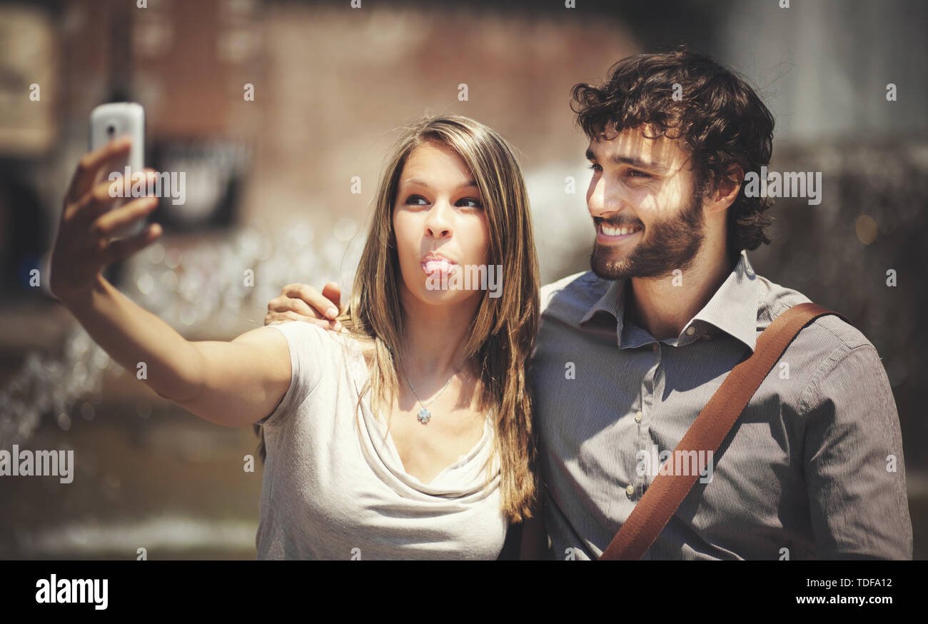 Couple of turists taking a selfie in the city Stock Photo