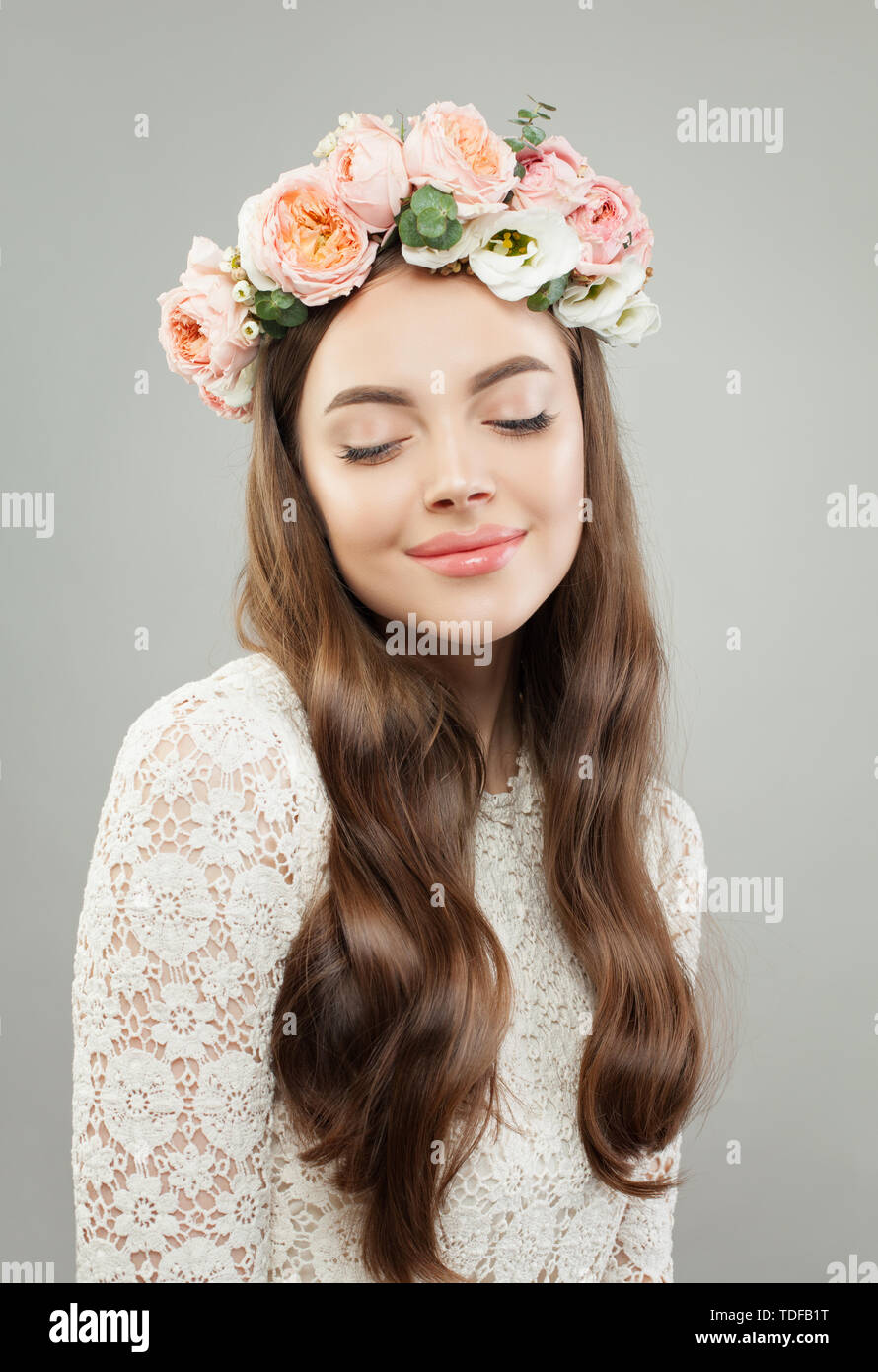 shiny flower model Young beautiful woman. Pretty model girl with clear skin, long shiny hair  and flowers relaxing Stock Photo - Alamy