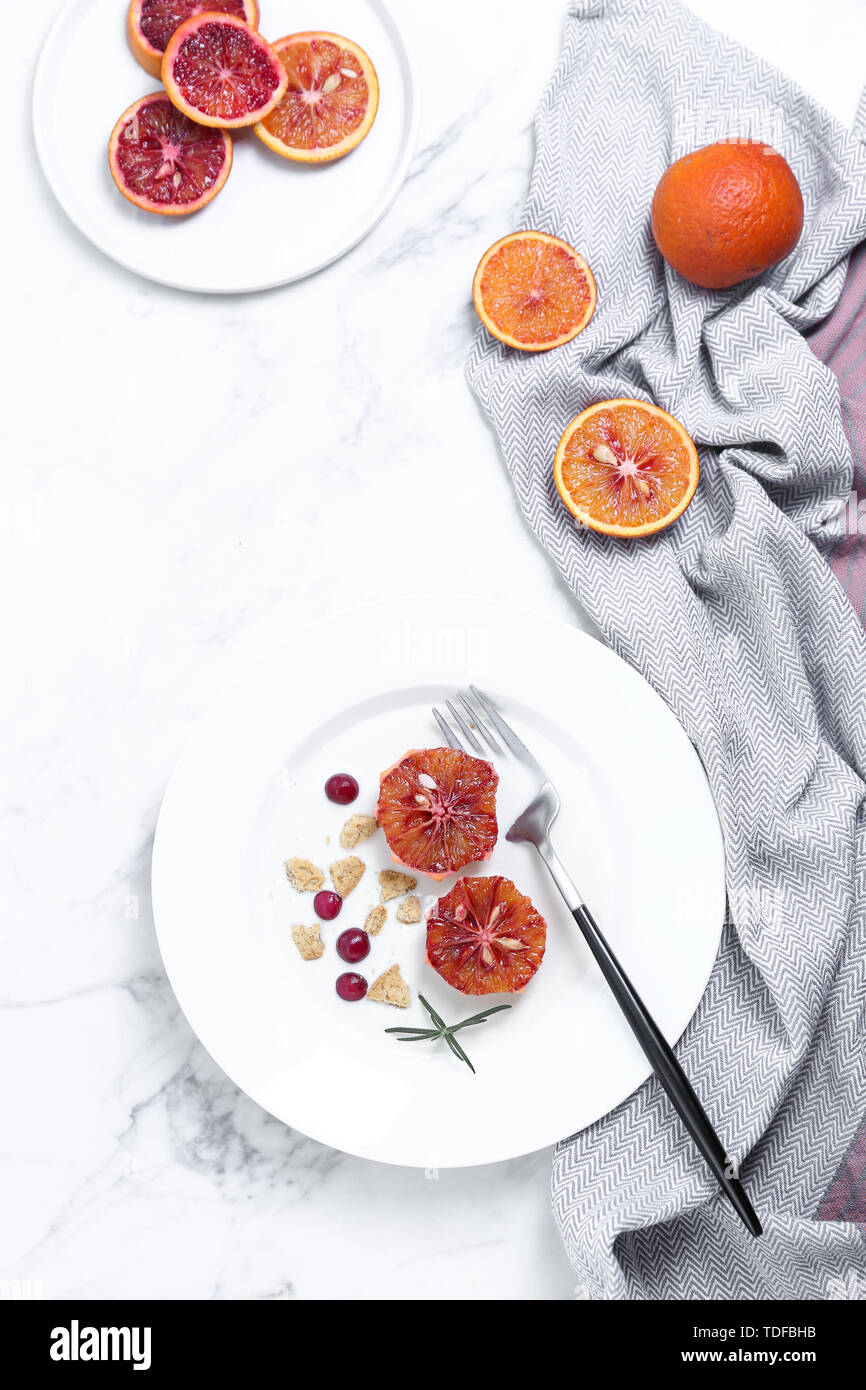 One person eating yogurt cereal fruit breakfast on white background Stock Photo