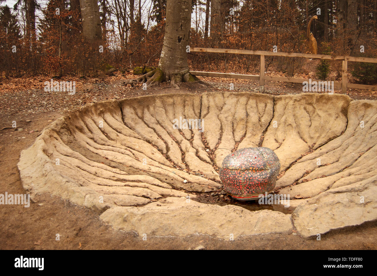Rasnov, Romania - December 4 2017: Dinosaur egg in crater at Dino Park Rasnov, the only dinosaur theme park in Romania and the largest in south-easter Stock Photo