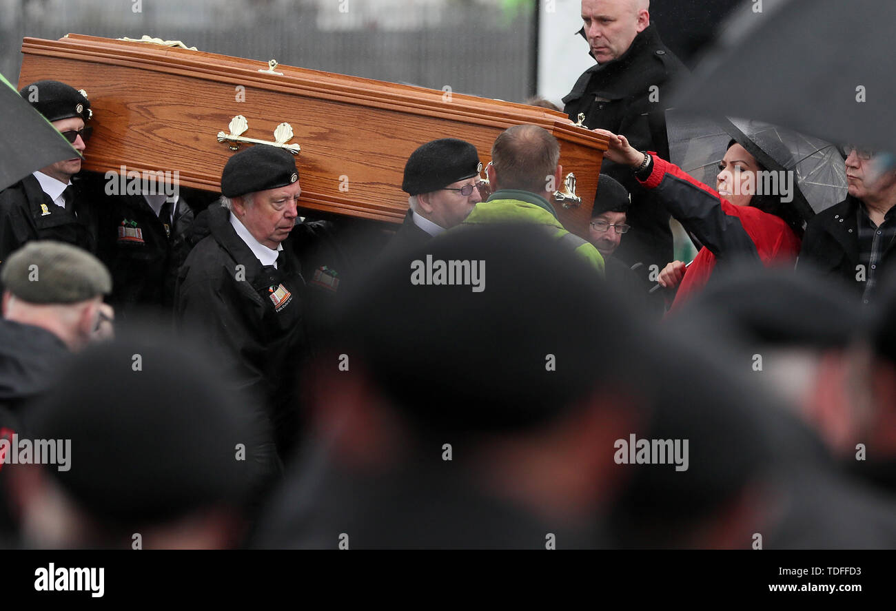 The coffin of former Provisional IRA leader Billy McKee is carried by members of 'D Company' as it enters Milltown cemetery in Belfast. Stock Photo