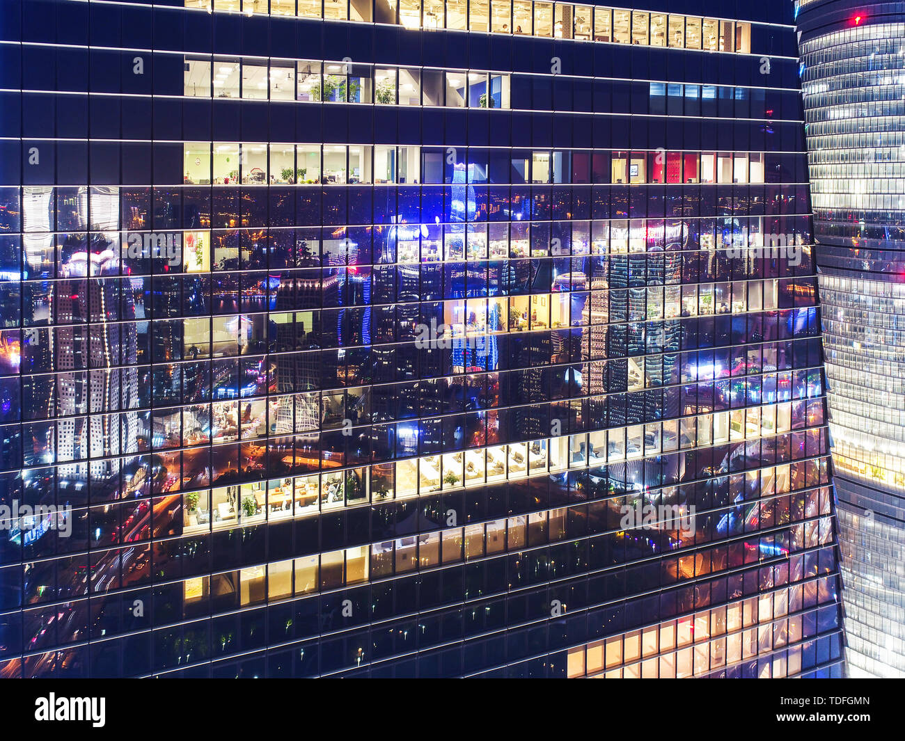 Night view of office buildings in a bustling city Stock Photo - Alamy