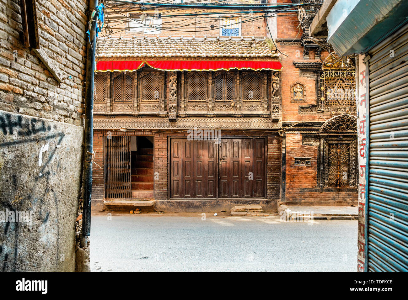 View at the decorative wood carving at the old house facade in Thamel, Kathmandu, Nepal. Stock Photo