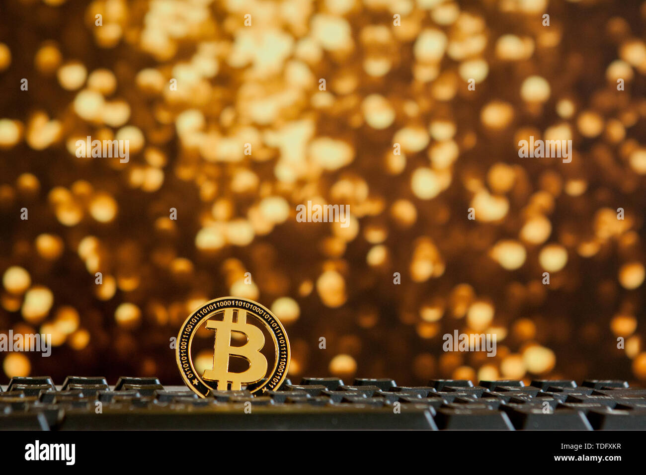 Bitcoin currency on keyboard computer on bokee background.Virtual cryptocurrency concept Stock Photo