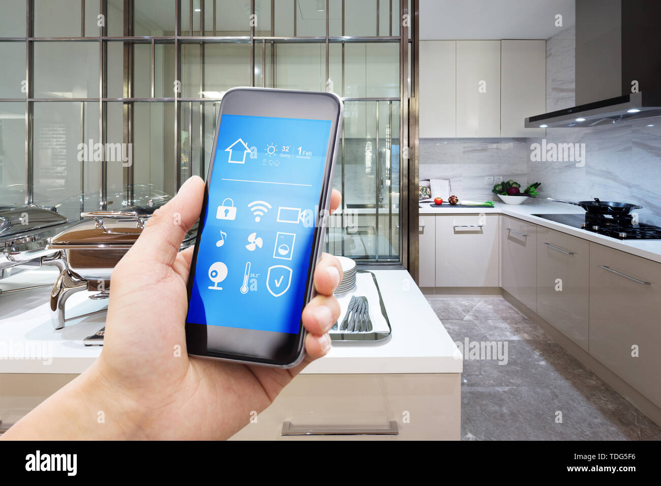 smart phone with smart home with modern kitchen Stock Photo - Alamy