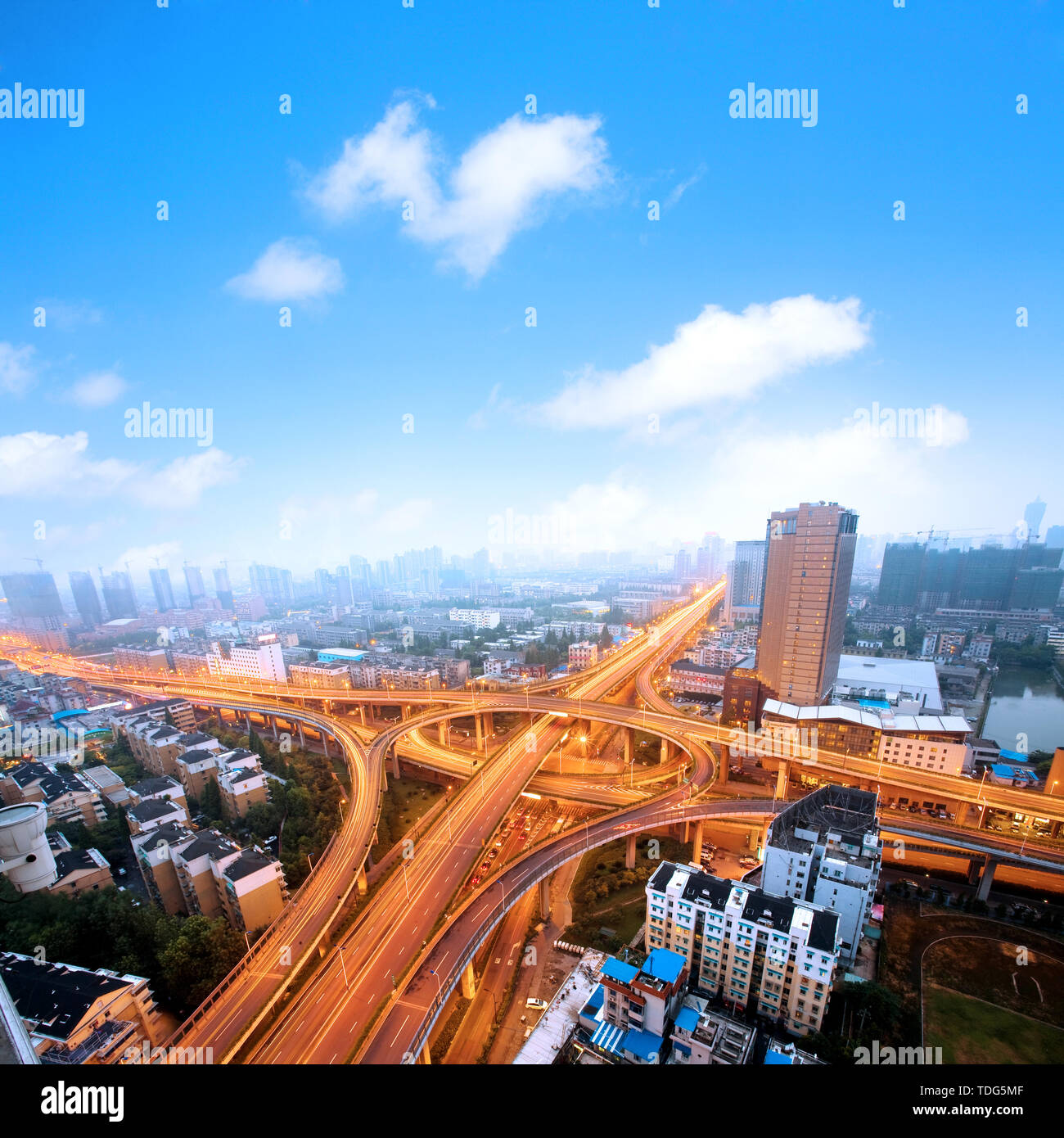 Freeway in night with cars light in modern city. Stock Photo