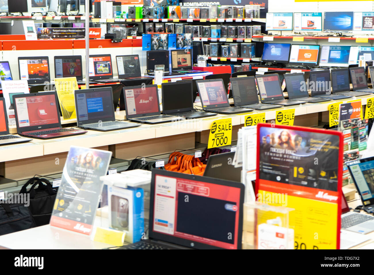 Chelyabinsk Region, Russia - June 2019. Household electrical appliances store M Video. Shelving with goods. Computers and laptops. Stock Photo
