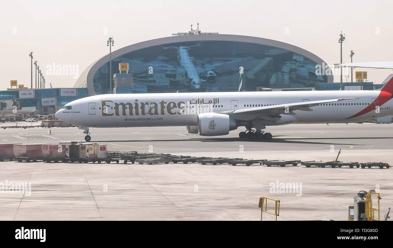 DUBAI, UNITED ARAB EMIRATES- AUGUST, 22, 2016: emirates boeing 777 plane taxiing to runway at dubai airport in the united arab emirates Stock Photo