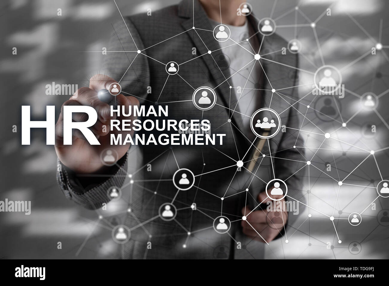 Businessman pointing on HRM Human Resource Management  sign Stock Photo  by kritchanut 84785524