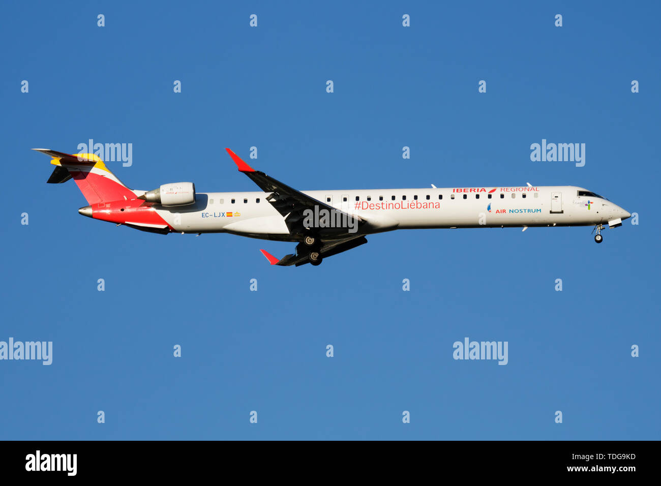 MADRID / SPAIN - MAY 2, 2016: Iberia Regional Air Nostrum Bombardier CRJ-1000 EC-LJX passenger plane landing at Madrid Barajas Airport Stock Photo